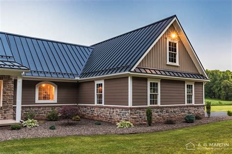 houses with black metal roofs